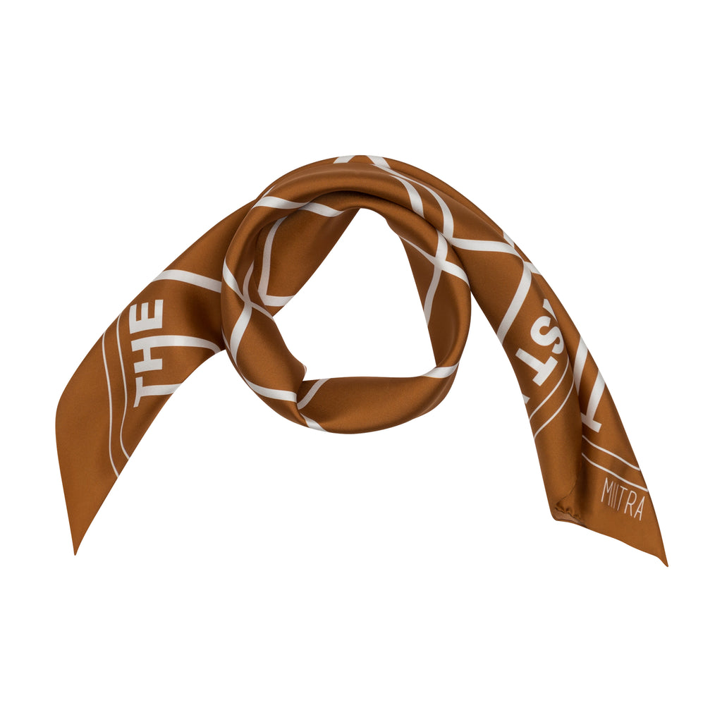 Styled view of a brown silk scarf wrapped around in a circle